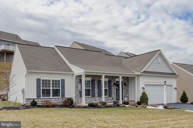 view of front of house with a garage and a front yard