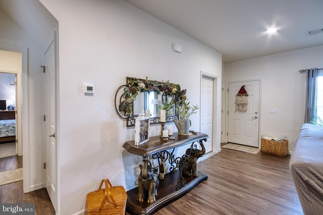 foyer with dark hardwood / wood-style flooring