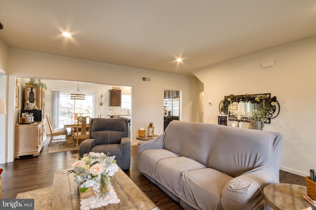 living room with dark hardwood / wood-style flooring