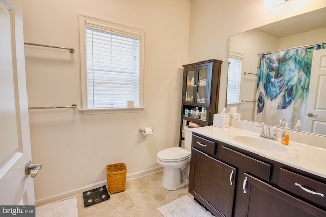 bathroom featuring vanity and toilet