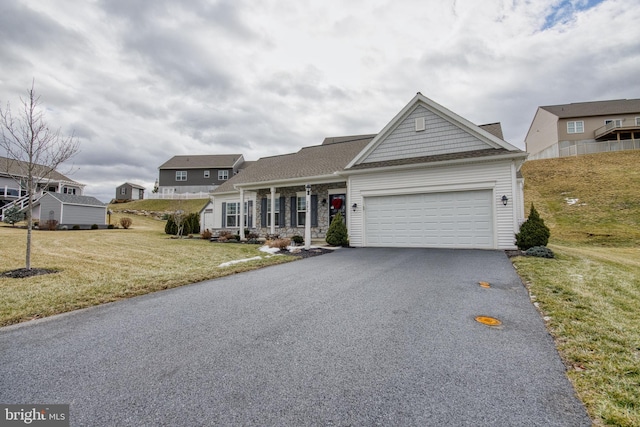 view of front facade with a garage and a front yard