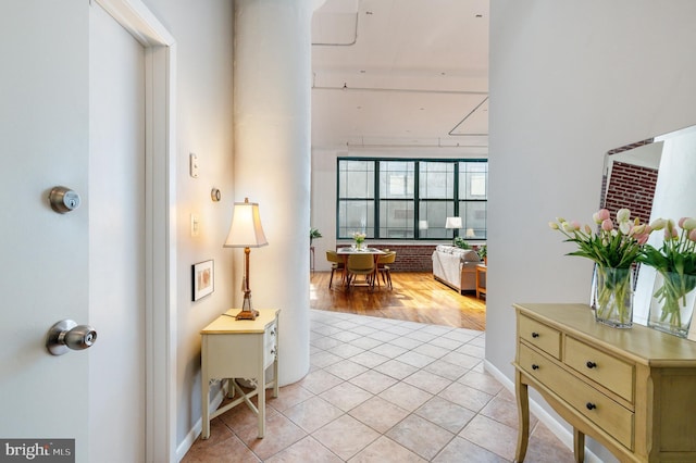 hall with light tile patterned flooring