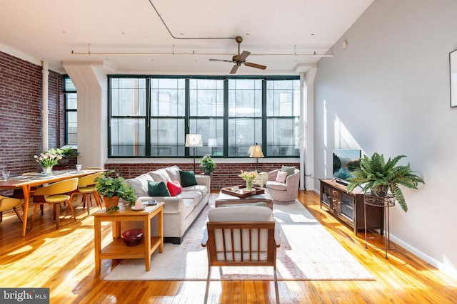 sunroom featuring ceiling fan