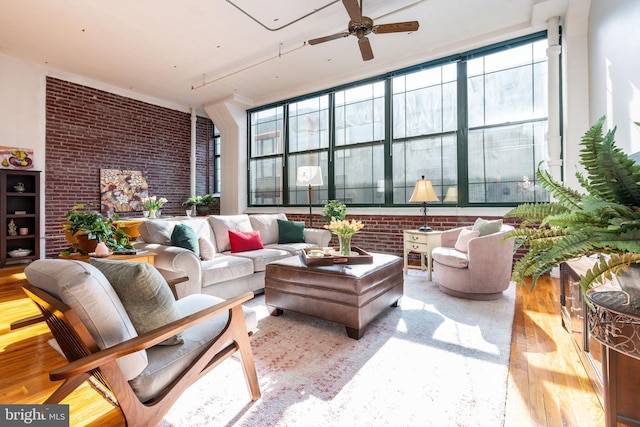 sunroom featuring ceiling fan