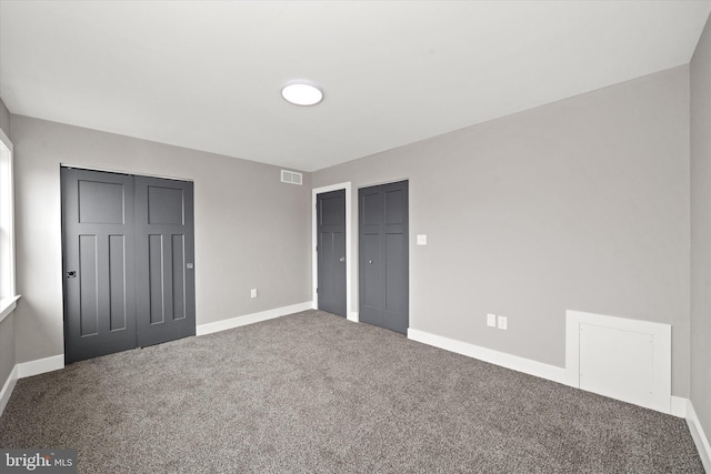 unfurnished bedroom with carpet flooring