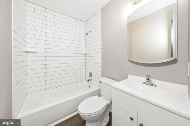 full bathroom featuring vanity, toilet, tiled shower / bath combo, and wood-type flooring