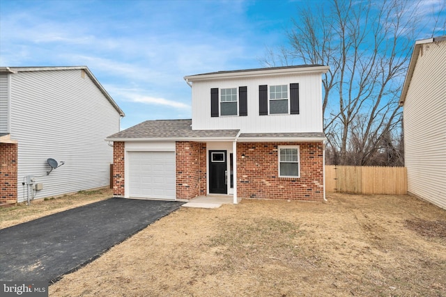 front facade with a garage and a front yard