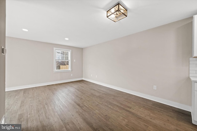 spare room with hardwood / wood-style floors