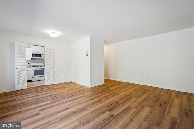 unfurnished living room with light wood-type flooring