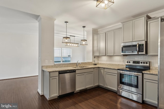 kitchen with gray cabinets, light stone countertops, appliances with stainless steel finishes, and sink