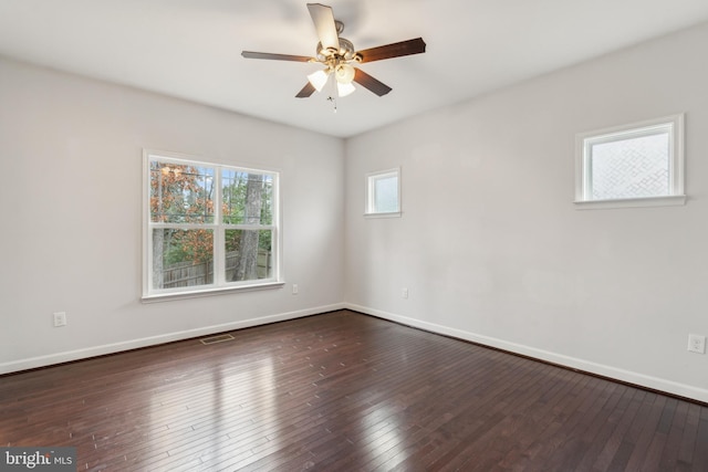 unfurnished room with dark hardwood / wood-style floors and ceiling fan