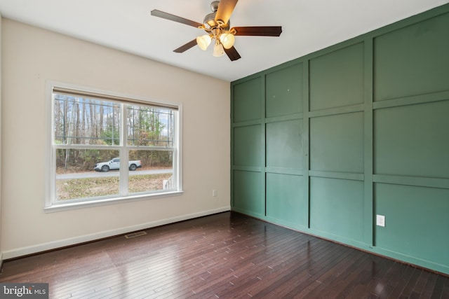 unfurnished bedroom with dark wood-type flooring and ceiling fan