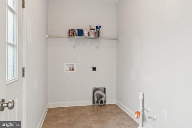 clothes washing area featuring gas dryer hookup, a healthy amount of sunlight, washer hookup, and hookup for an electric dryer