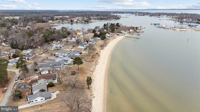 aerial view with a water view and a view of the beach