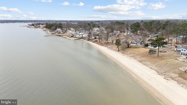 drone / aerial view with a water view and a view of the beach