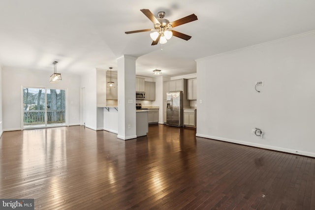 unfurnished living room featuring ornamental molding, dark hardwood / wood-style floors, and ceiling fan