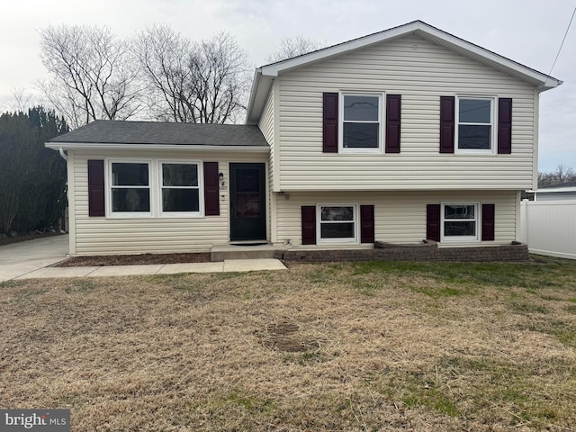 split level home featuring a front yard