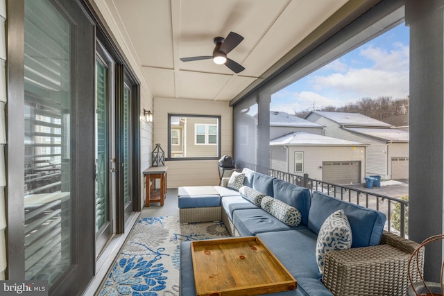 sunroom / solarium featuring ceiling fan