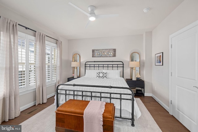 bedroom featuring ceiling fan and dark hardwood / wood-style flooring