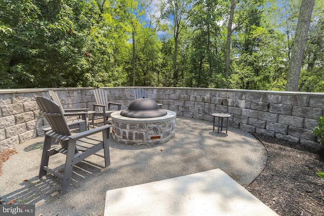 view of patio / terrace with a fire pit