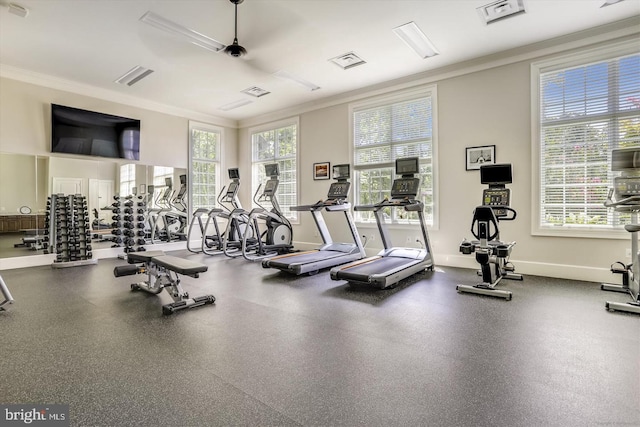 exercise room featuring crown molding