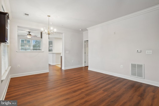 spare room with dark wood-type flooring, ornamental molding, and ceiling fan with notable chandelier