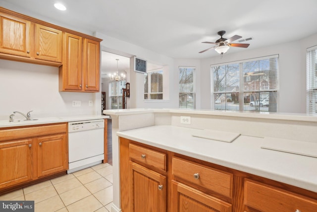 kitchen featuring dishwasher, ceiling fan with notable chandelier, sink, and light tile patterned floors