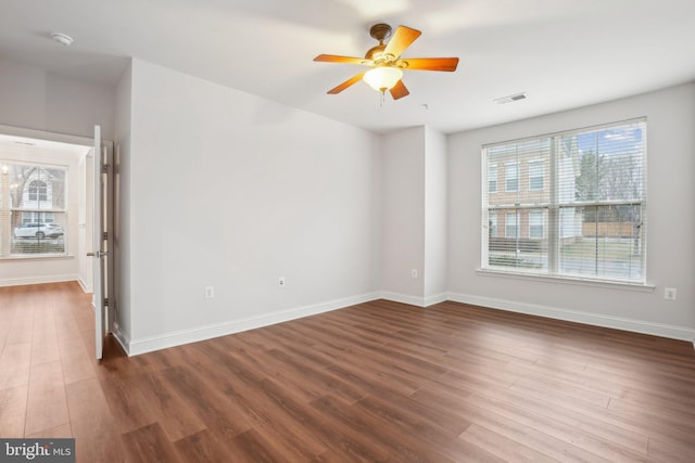 spare room with wood-type flooring and ceiling fan