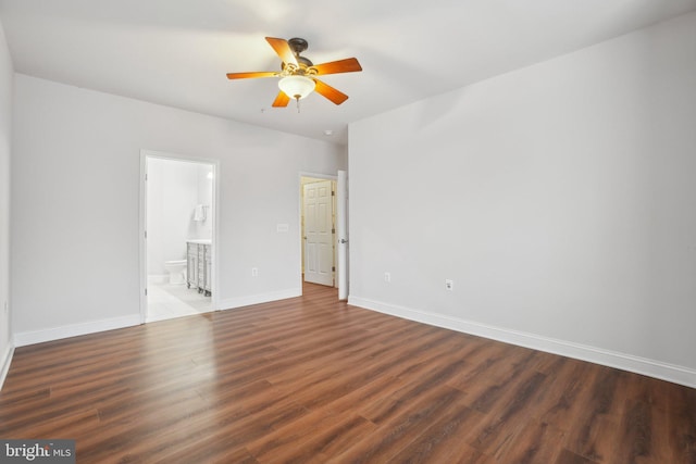 unfurnished room featuring ceiling fan and dark hardwood / wood-style flooring