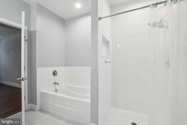 bathroom with shower with separate bathtub