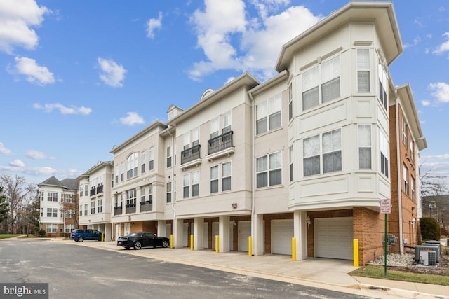 view of property featuring central AC and a garage