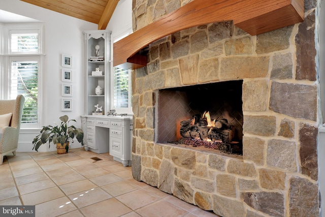 interior details featuring a stone fireplace and built in study area