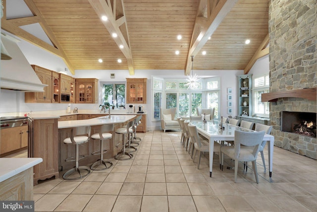 dining area with plenty of natural light, wood ceiling, and high vaulted ceiling