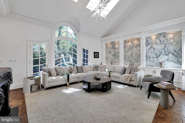 living area with high vaulted ceiling and a chandelier