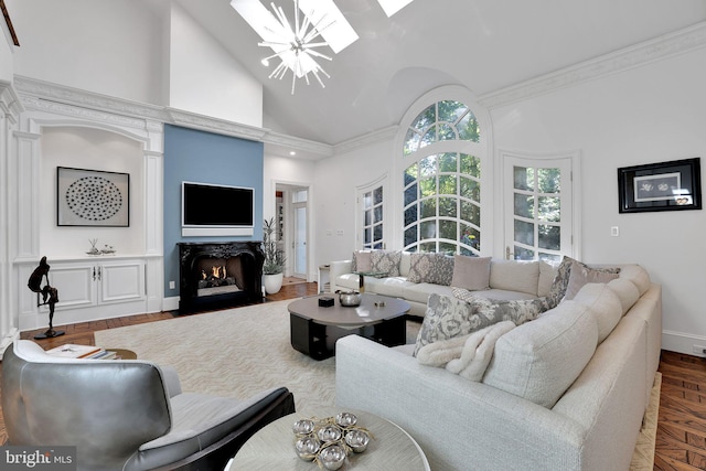 living area featuring high vaulted ceiling, a fireplace with flush hearth, baseboards, an inviting chandelier, and crown molding