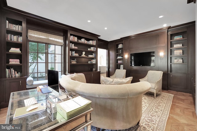 interior space featuring ornamental molding, built in shelves, and recessed lighting