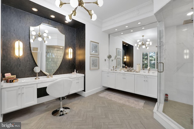 bathroom featuring a chandelier, a stall shower, crown molding, and vanity