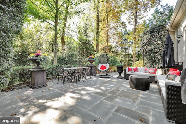 view of patio / terrace featuring outdoor dining space and an outdoor hangout area