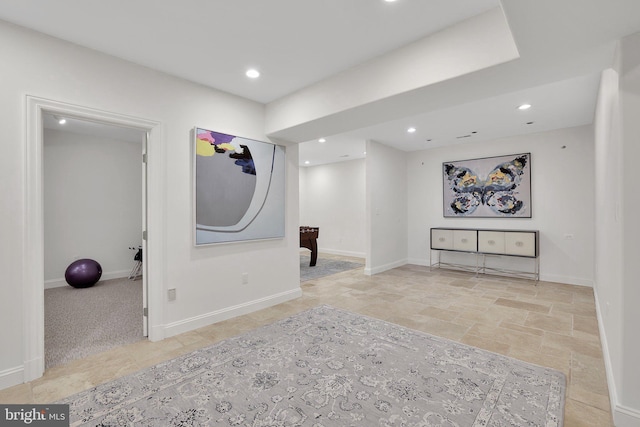 interior space featuring recessed lighting and baseboards