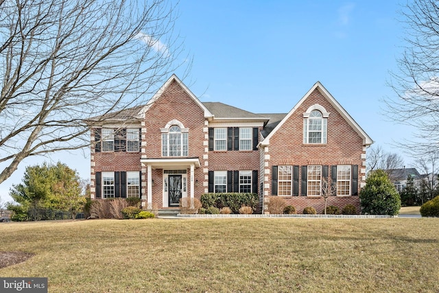 colonial home with a front yard