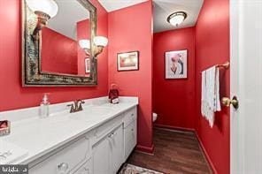 bathroom featuring hardwood / wood-style flooring and vanity