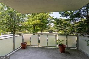 view of patio featuring a balcony