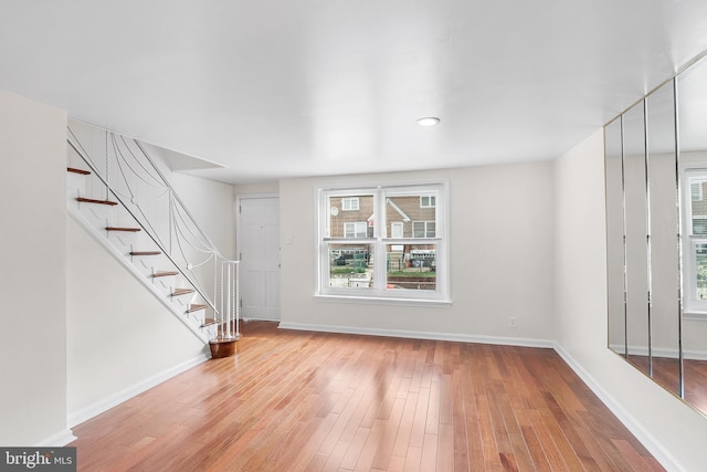 unfurnished living room featuring light wood-type flooring