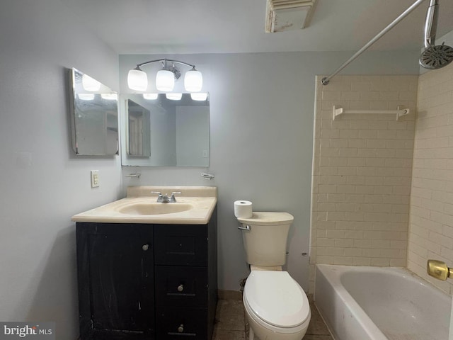 full bathroom with tiled shower / bath combo, vanity, and toilet