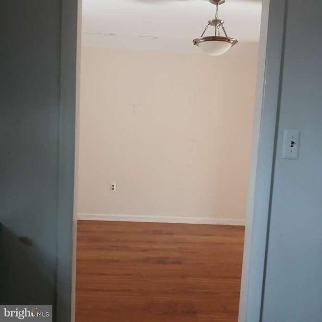 empty room with dark wood-type flooring