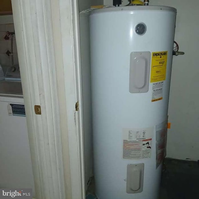 utilities featuring washer / clothes dryer and electric water heater