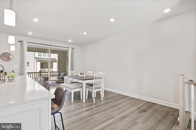 dining room with light hardwood / wood-style flooring