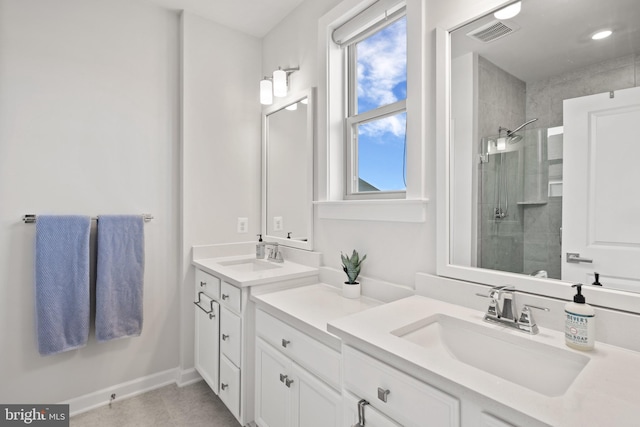 bathroom featuring vanity and a shower with shower door