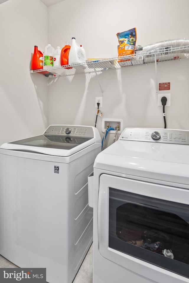 laundry area featuring independent washer and dryer