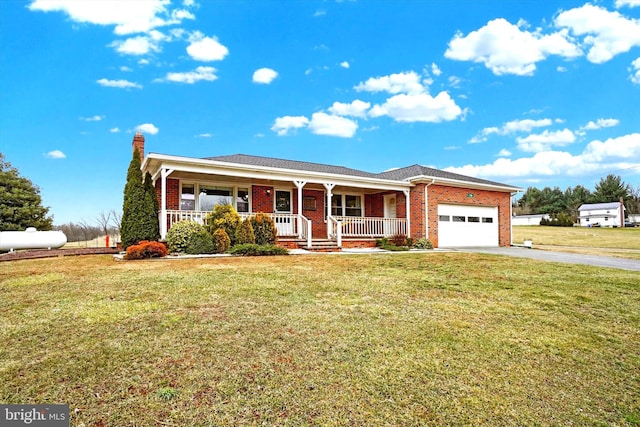 single story home with a porch, a garage, and a front yard